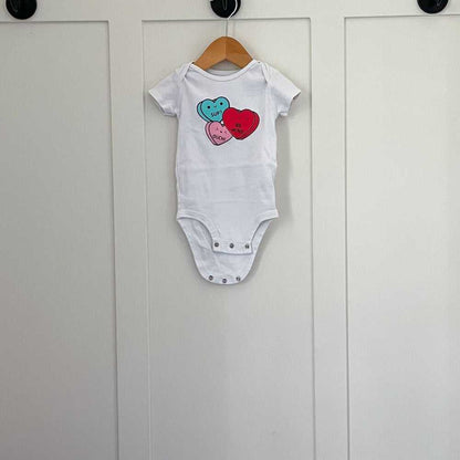 3-6m Cute Kawaii Unisex White Onesie, Hearts, Valentines, Fun Top for Kids Kids > One Pieces > Bodysuits 9 $ Buttons & Beans Co.